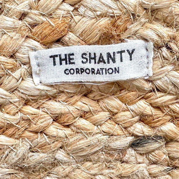 The Shanty Moroccan Round Crossbody Woven Jute Straw Beach Bag in Natural - Picture 6 of 11